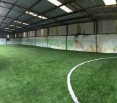 Artificial grass outdoor space at Behan Lodge