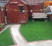 artificial grass installation over stones
